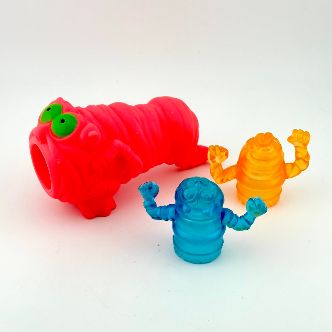 Colorful toy figures on a gradient white background