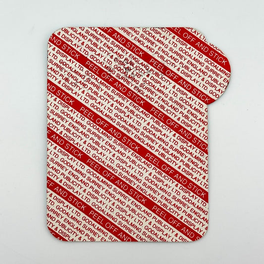 Backside of pass to show unused adhesive backing.