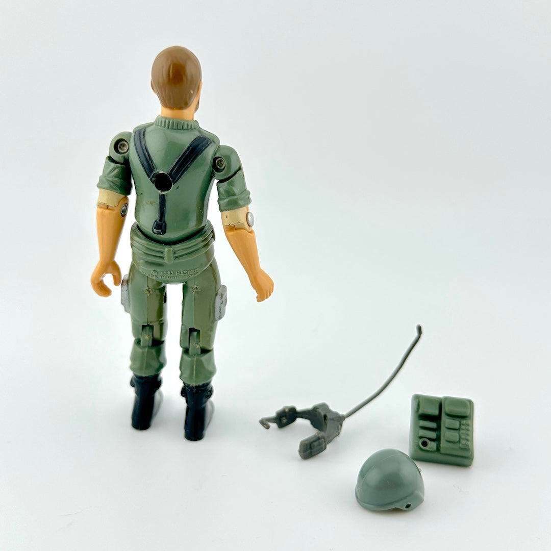 GI Joe action figure with accessories against white background.