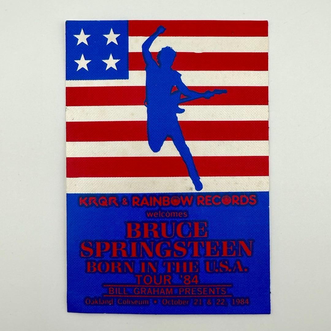Rectangular Bruce Springsteen pass with red white & blue flag, silhouette & text.