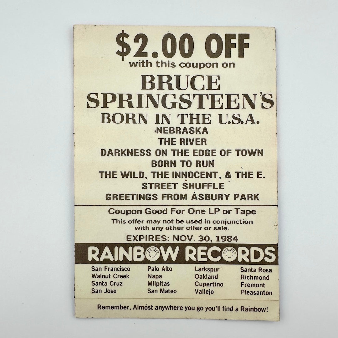 Backside of pass with black text about tour & Rainbow Records locations.