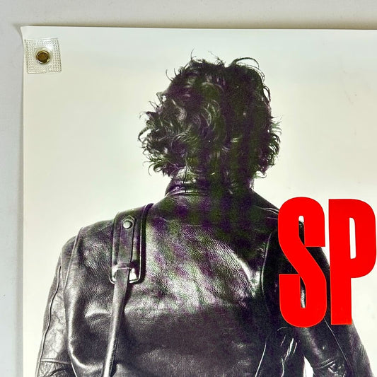 Top left corner of poster with wear to corner