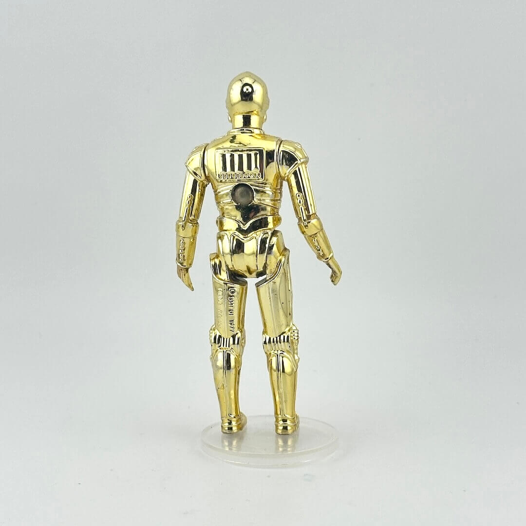 Gold robot figure on a gray background