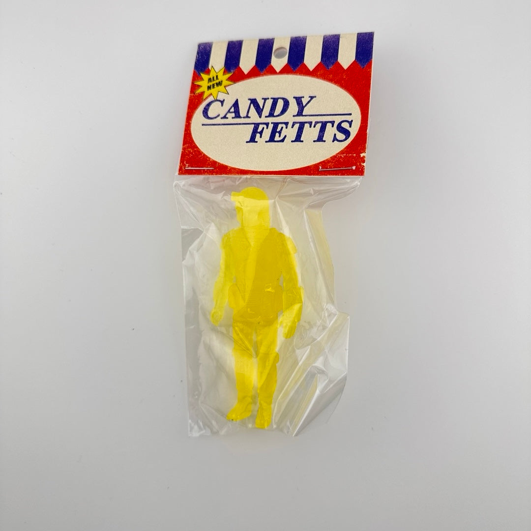 Yellow semi-transparent custom figure of Boba Fett classic action figure in packaging, clear plastic bag & card-stock tag.
