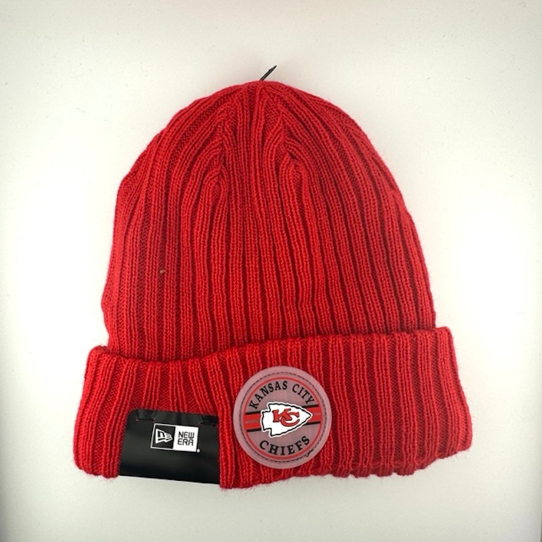 Red knit beanie with team crest logo patch front center. White stitched new era logo off center.