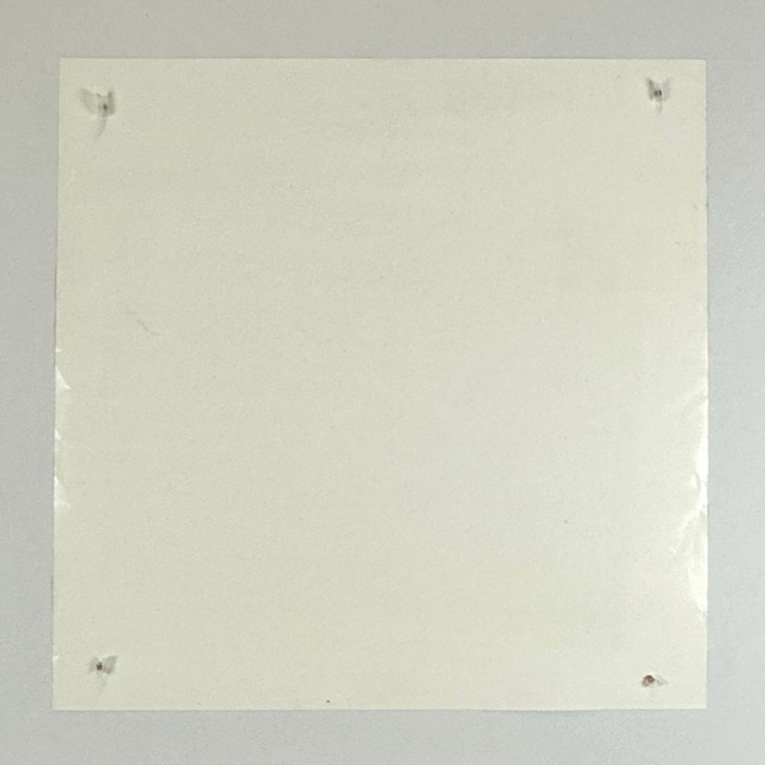 Backside of poster showing edge wear on either side reflected in light.