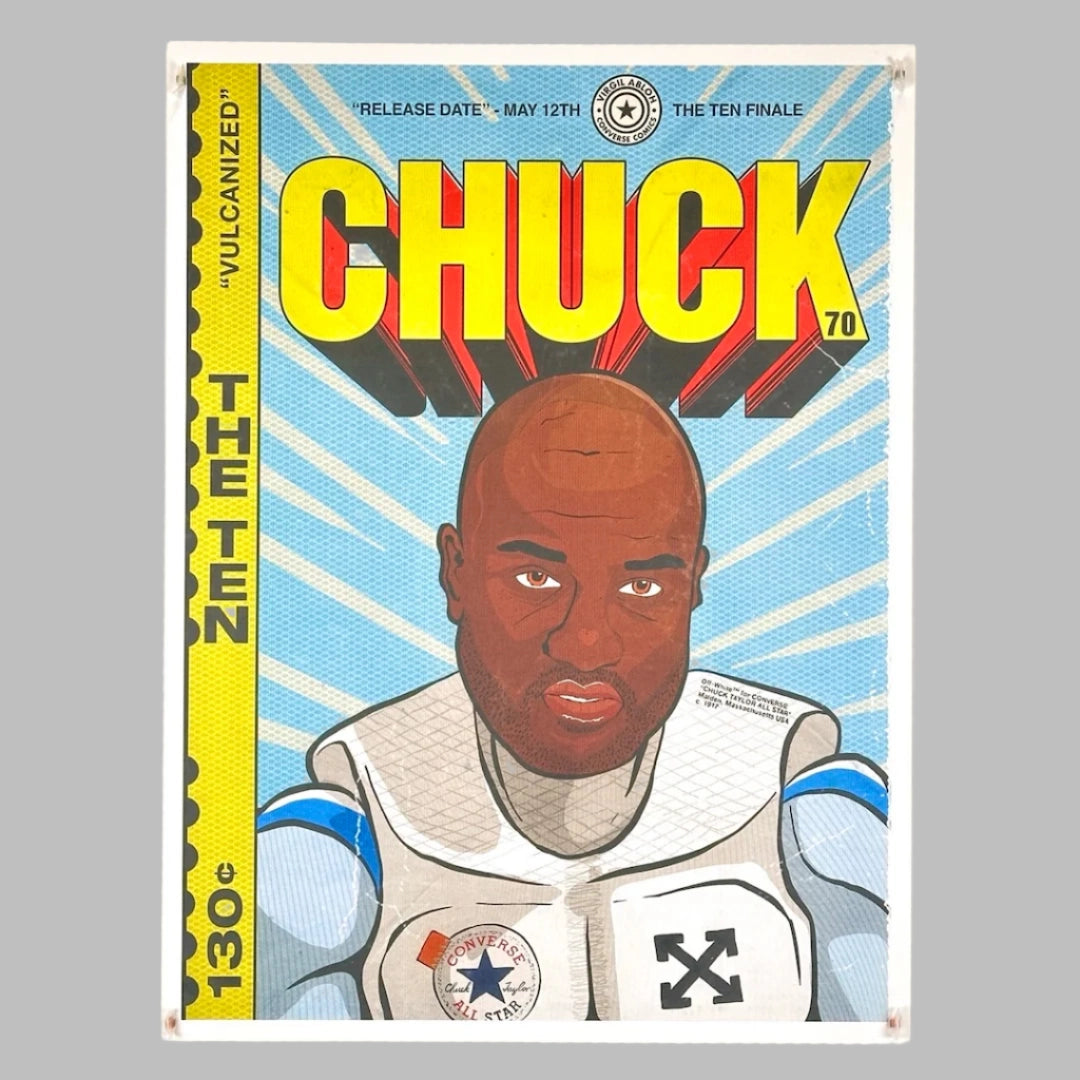 Comic book style print of man in white outfit looking straight ahead with yellow banner down left side under yellow title.