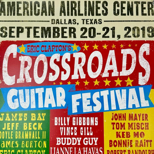 Close up of Eric Clapton's Guitar Festival logo at center.