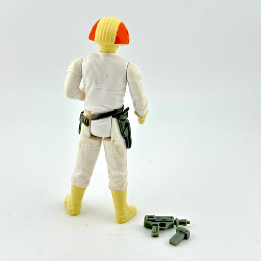Toy figure in white outfit with two gray accessories on white background.