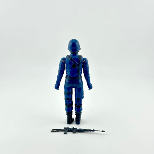 Back of GI Joe Cobra action figure with weapon against white background.