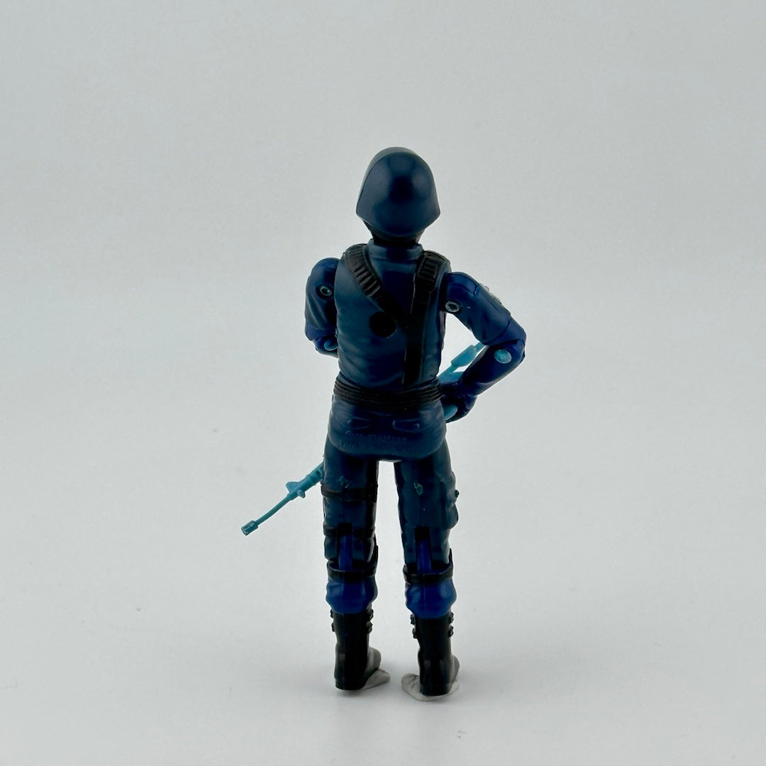 White, male, masked ninja in blue uniform with black details, red COBRA logo on chest. Carrying mini rifle. Back view.