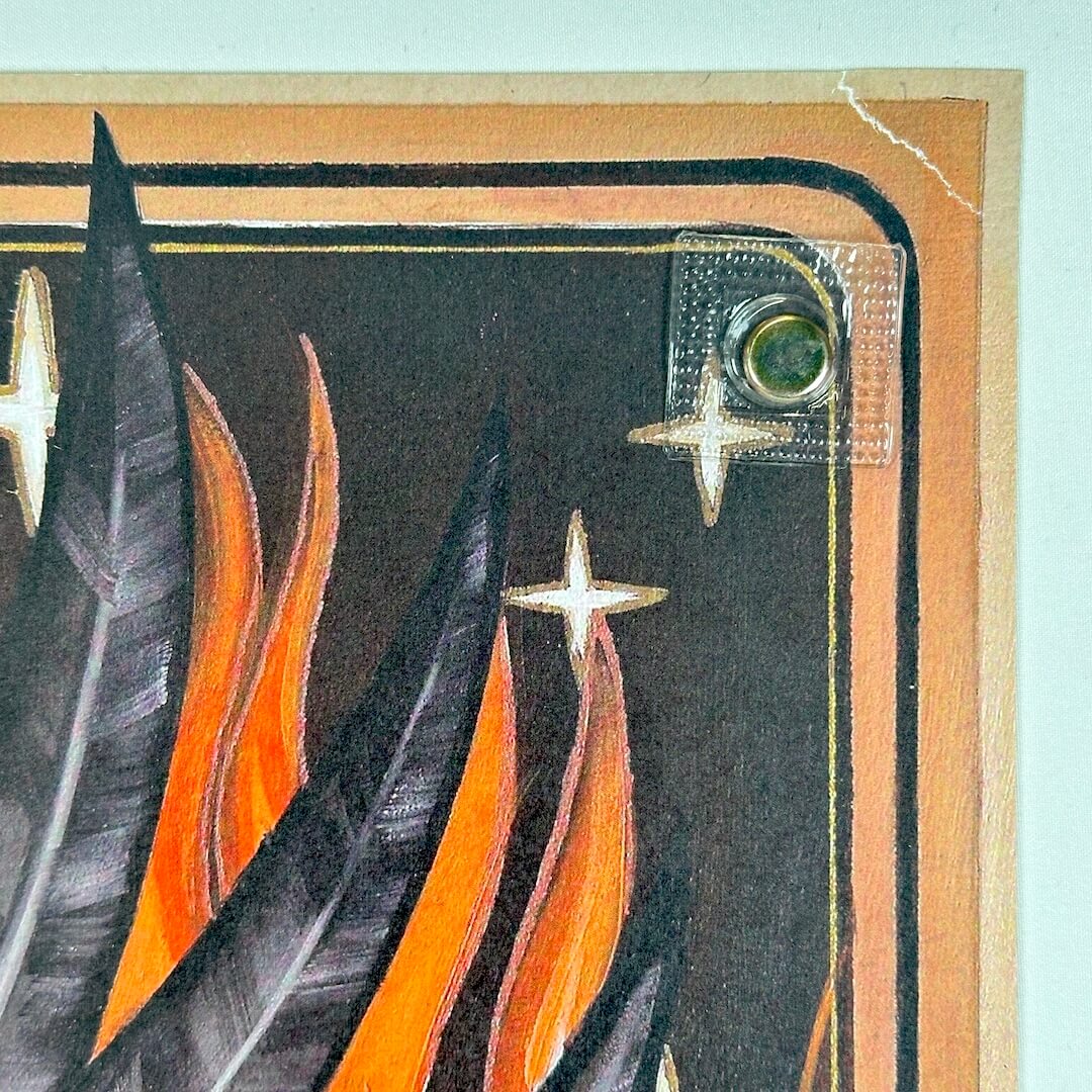 Top left corner showing tear to corner, repaired with tape.