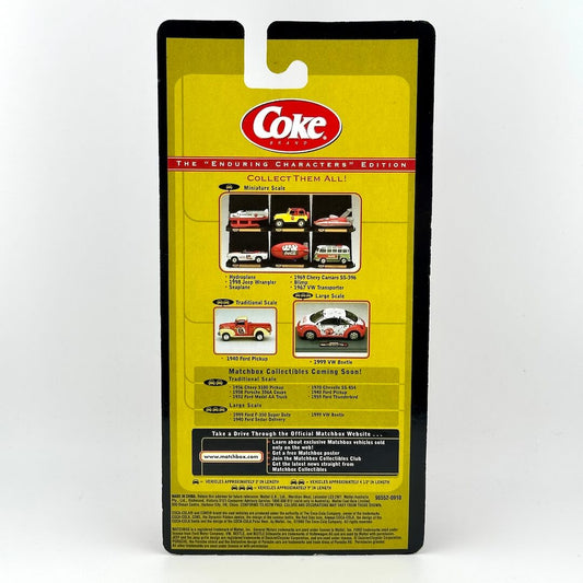Back of diecast car packaging with Coke logo, product information, and images of other available cars.