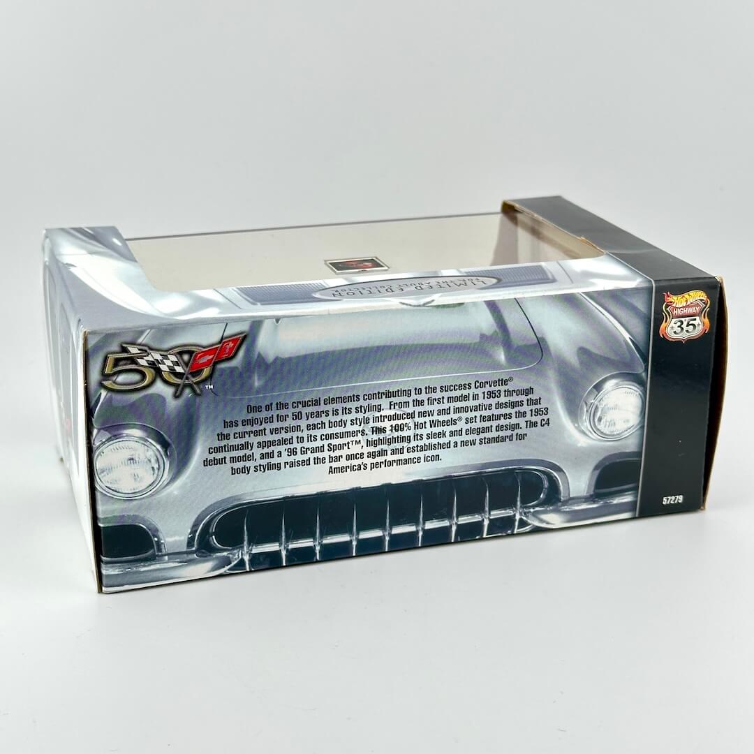 A boxed die-cast model car shown from the back, inside a clear plastic window box with printed product information.