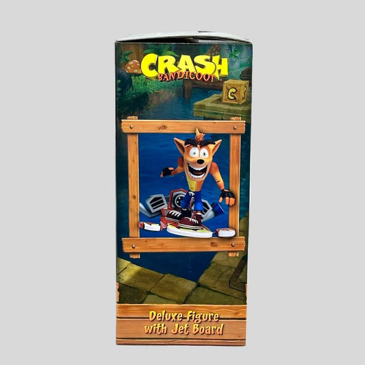Boxed Crash Bandicoot figure with jet board on a white background