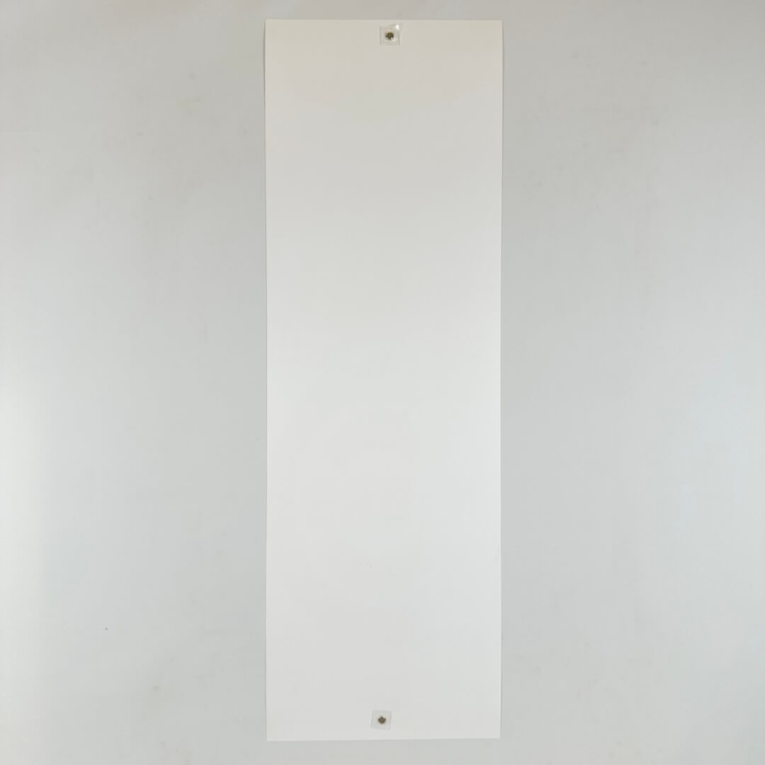 White sheet of paper on a gray background