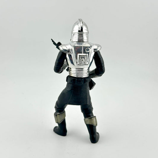 Figurine of a character in a silver helmet and black suit on a light gray background