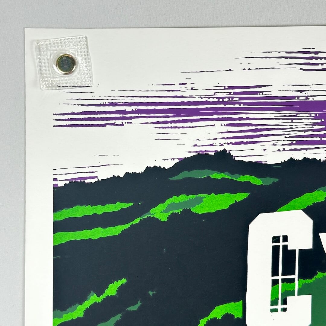 Top left corner of poster showing no damage to corner or edges.