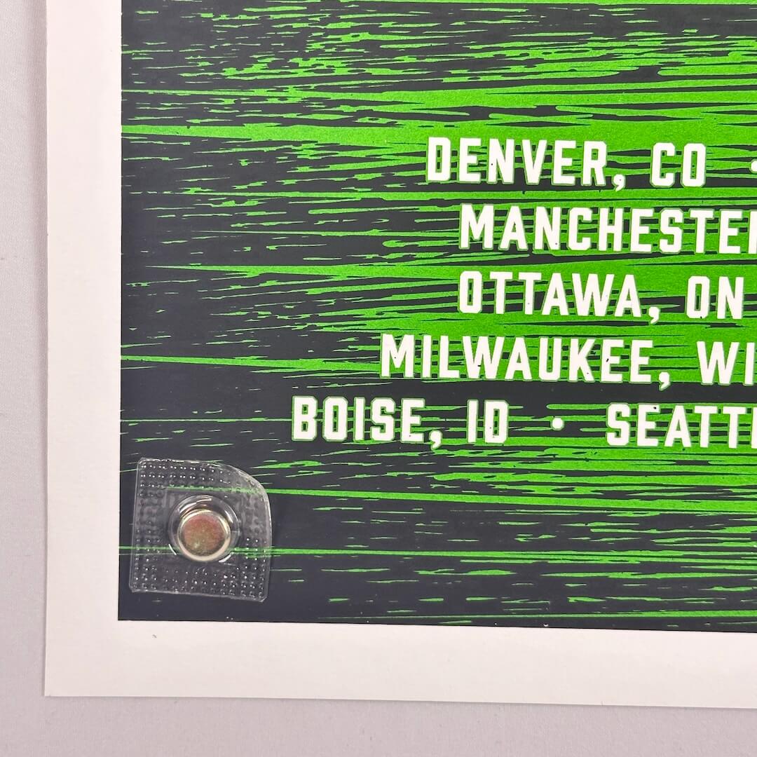 Bottom left corner of poster showing no damage to corner or edges.
