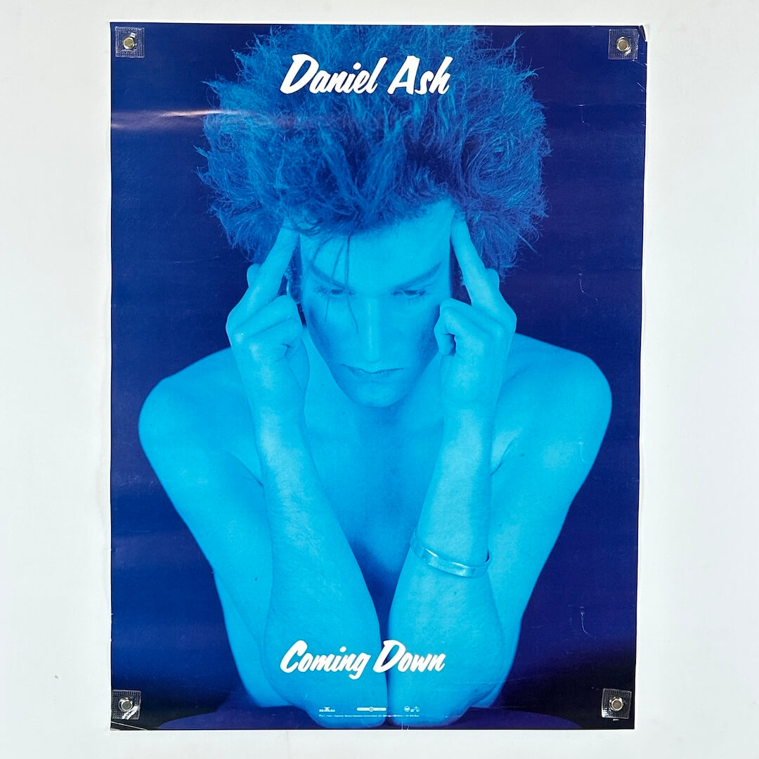 Album cover with a person in blue tones and 'Daniel Ash Coming Down' text.