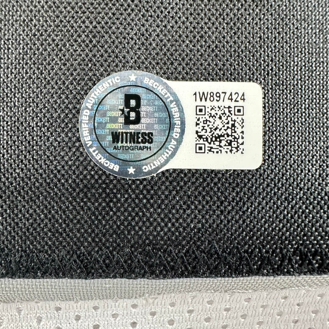 Authenticity label with QR code and text on a textured surface