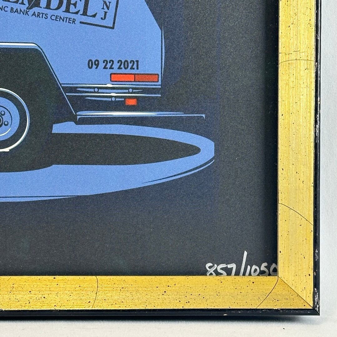 Close up of poster number written in silver marker at bottom right corner, number 857/1050.