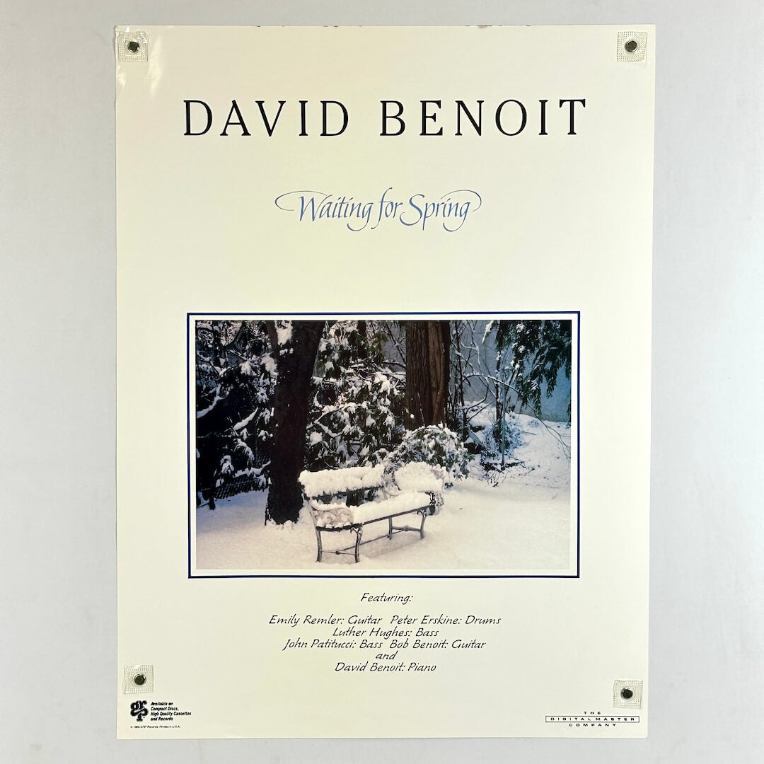 Poster with central image of park bench under snow with text above and below describing artists.
