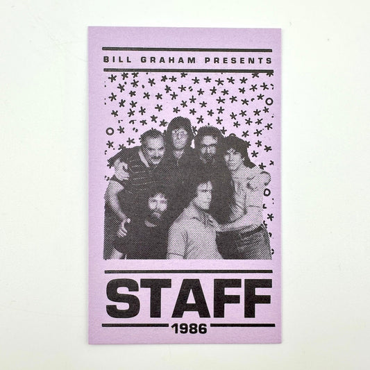 Purple rectangular card with image of band above "STAFF, 1986" text.