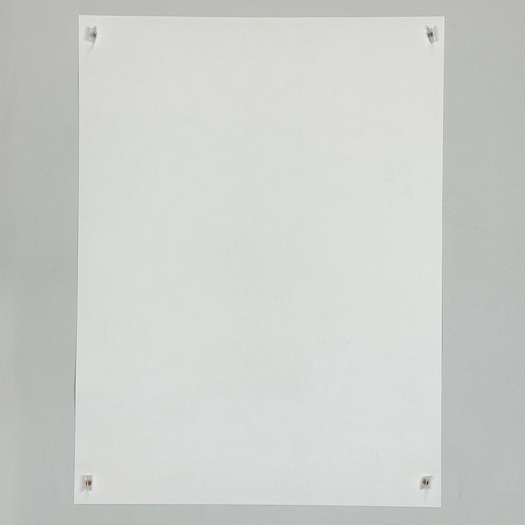 Backside of white poster showing no damage or wear.