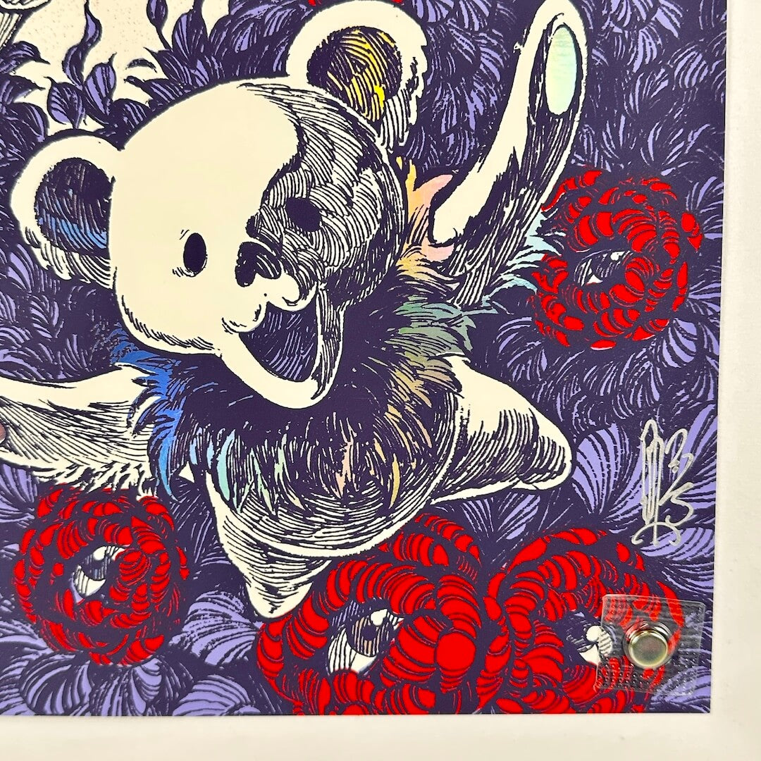 Bottom right corner of concert poster showing no damage to corner or edges. Artist signature in silver