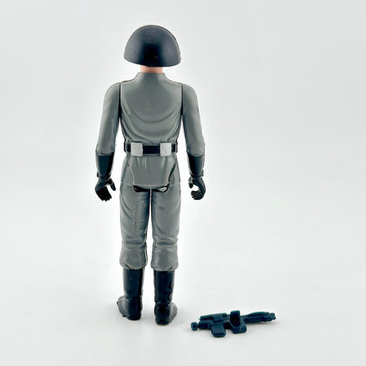 Gray action figure with helmet and boots on a white background