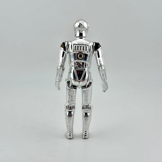 Silver robot toy figure on a gray background