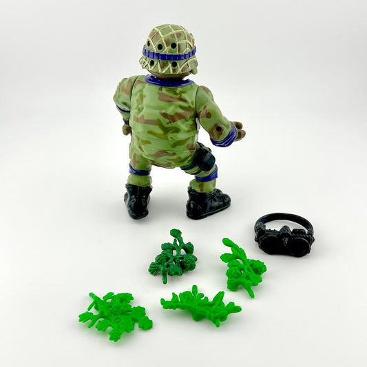 Toy figure in camouflage with accessories on a white background