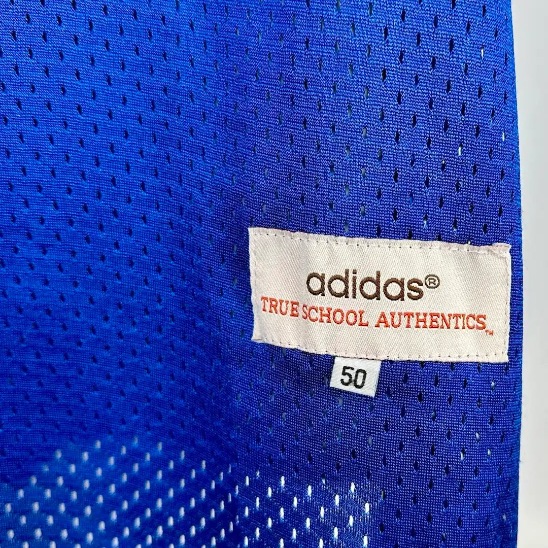 Close up of tag by front left hem, Adidas, True School Authentics, 50.