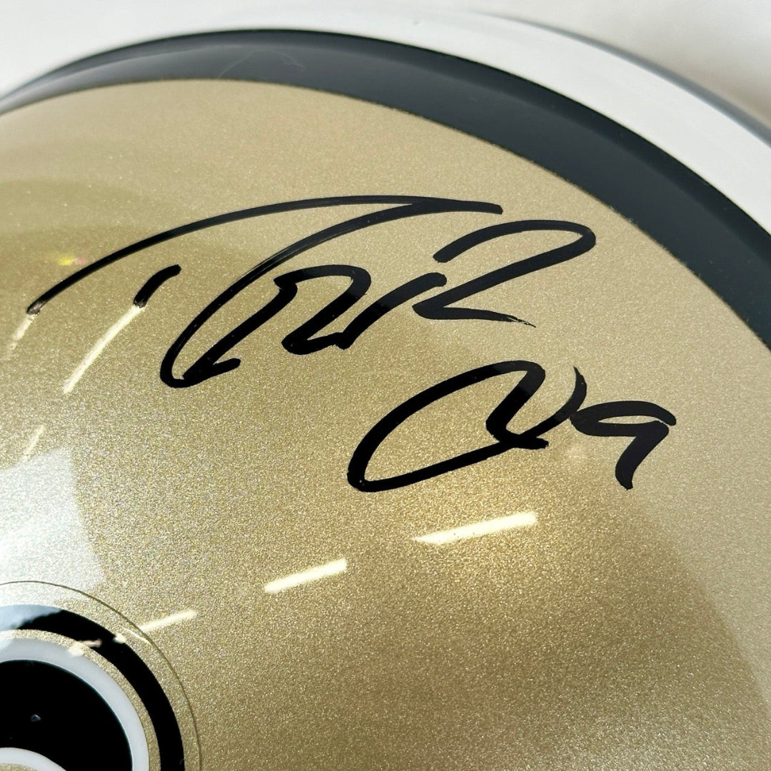 Close up of black marker signature placed below top center stripe on gold space above logo.