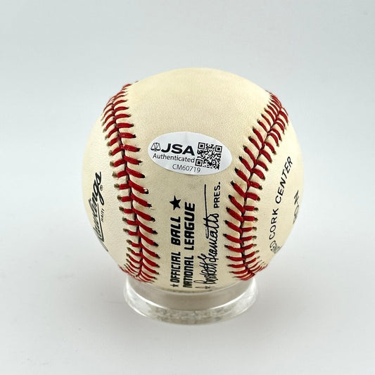 Baseball with JSA authentication label on a white background