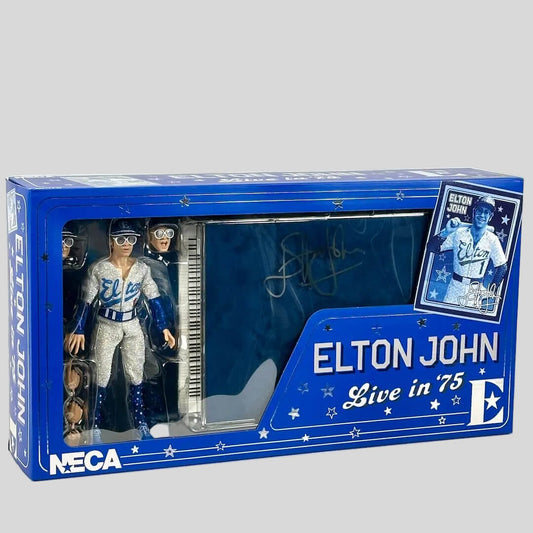 Elton John action figure in packaging with blue and white design