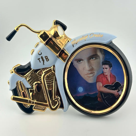Motorcycle shaped ceramic plate with Elvis portrait in front wheel of his face in the sky & dressed in red in foreground below