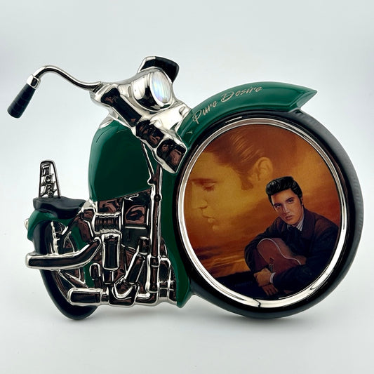 Motorcycle shaped ceramic plate with portrait in front wheel of Elvis in the sky & in black in foreground below.