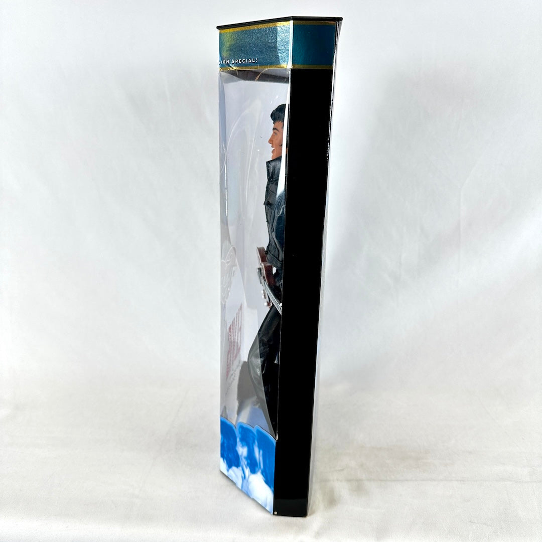 Toy figure in a clear packaging box on a white background
