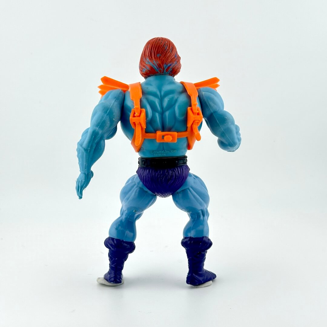 Toy figure with blue skin and orange costume on a white background