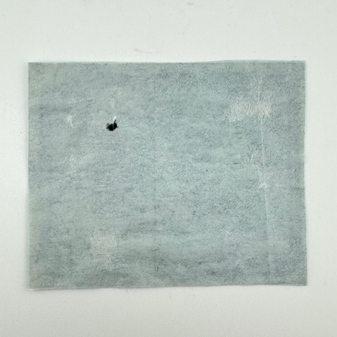 Backside of stub showing condition and adhesive still intact.