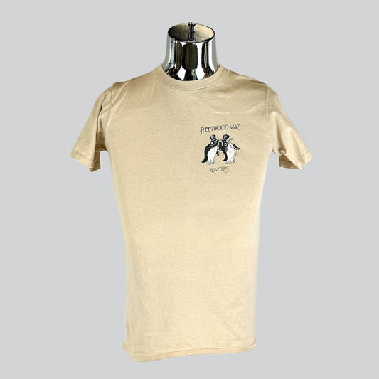 Beige Fleetwood Mac 'Rumors' t-shirt on metallic mannequin, featuring a small graphic of two tuxedoed penguins standing side by side.