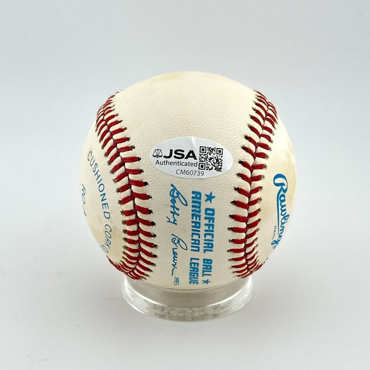 Baseball with JSA authentication sticker on a white background