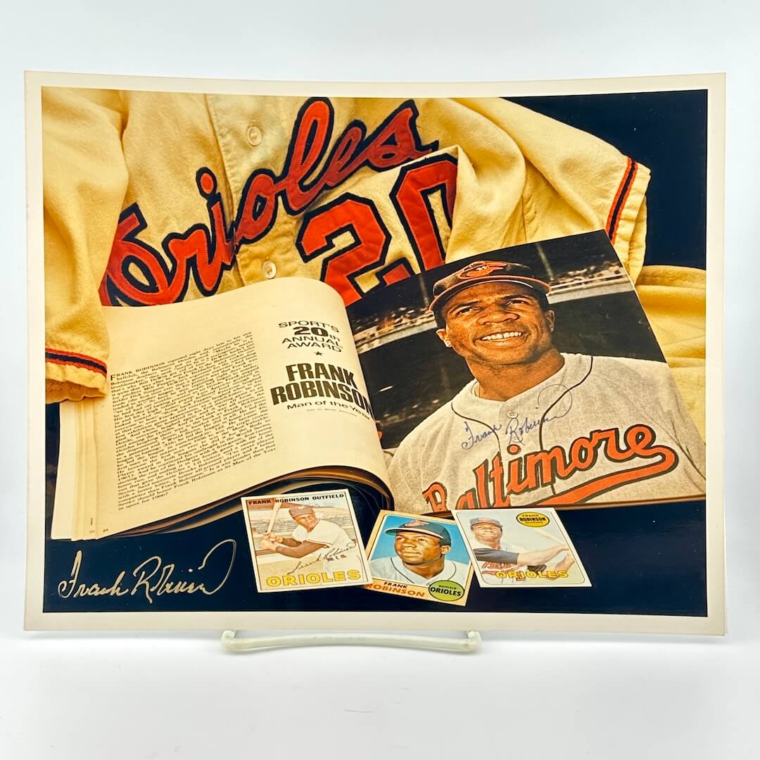 Photo of arranged baseball memorabilia featuring Frank Robinson and his signature.