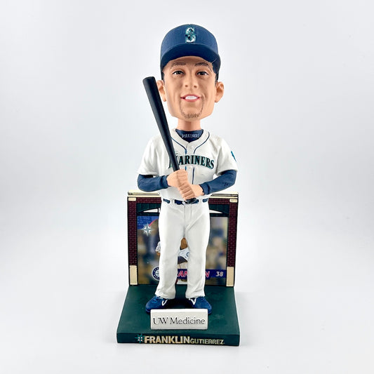 Baseball bobblehead figure holding a bat with a white background