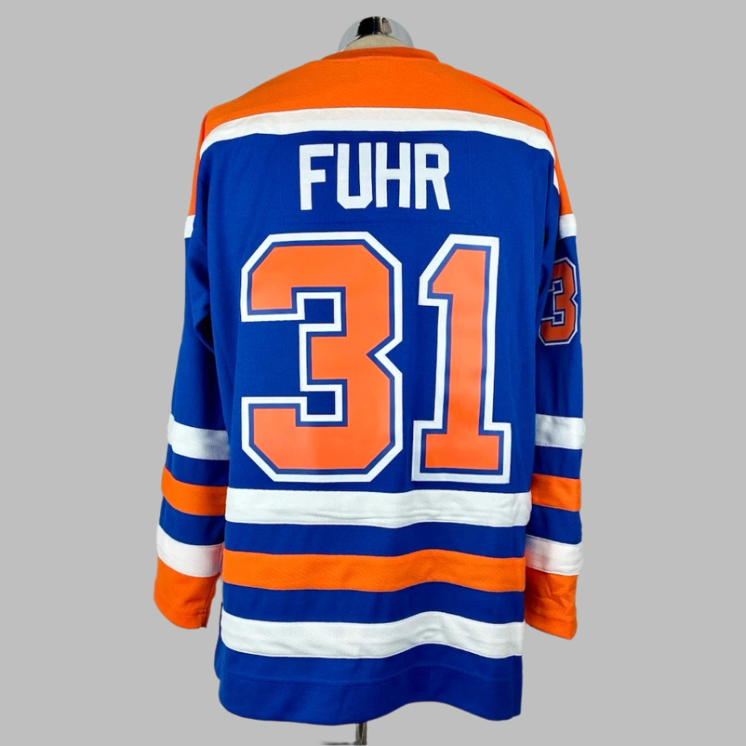 Jersey blue body & long sleeves, orange shoulders, white/orange stripes around waist & wrists. FUHR stitched nameplate & #