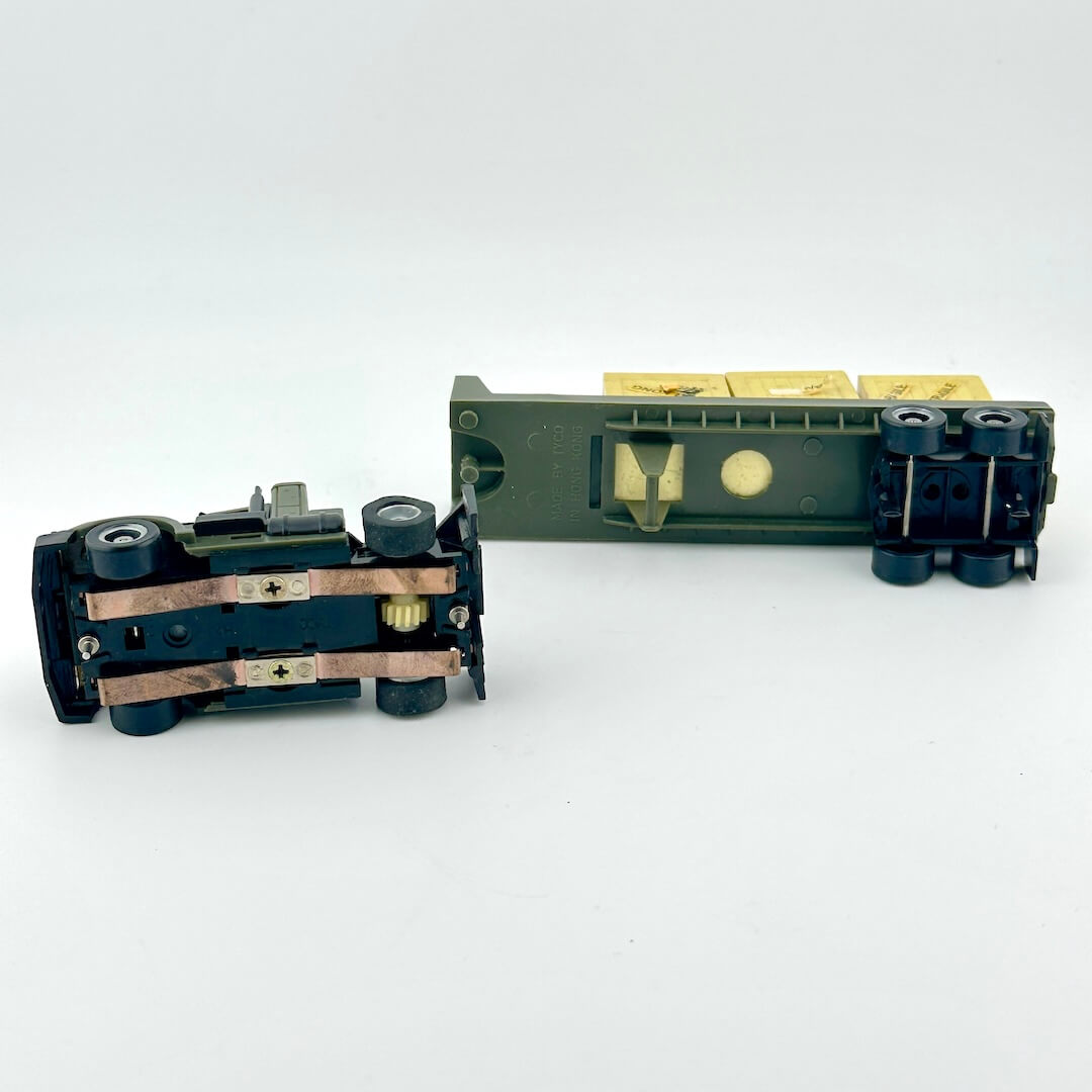 Underside of slot car to show electric components.