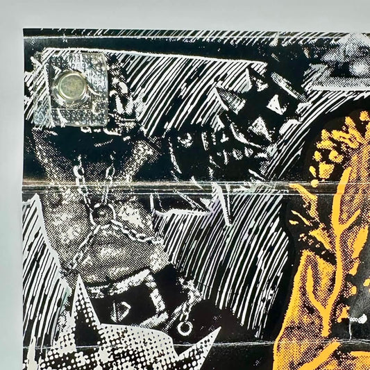 Top left corner of poster with creases and edge curling.