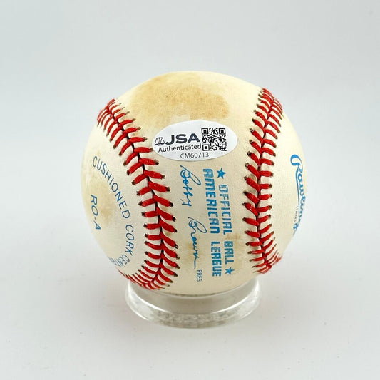 Baseball with JSA authentication label on a white background
